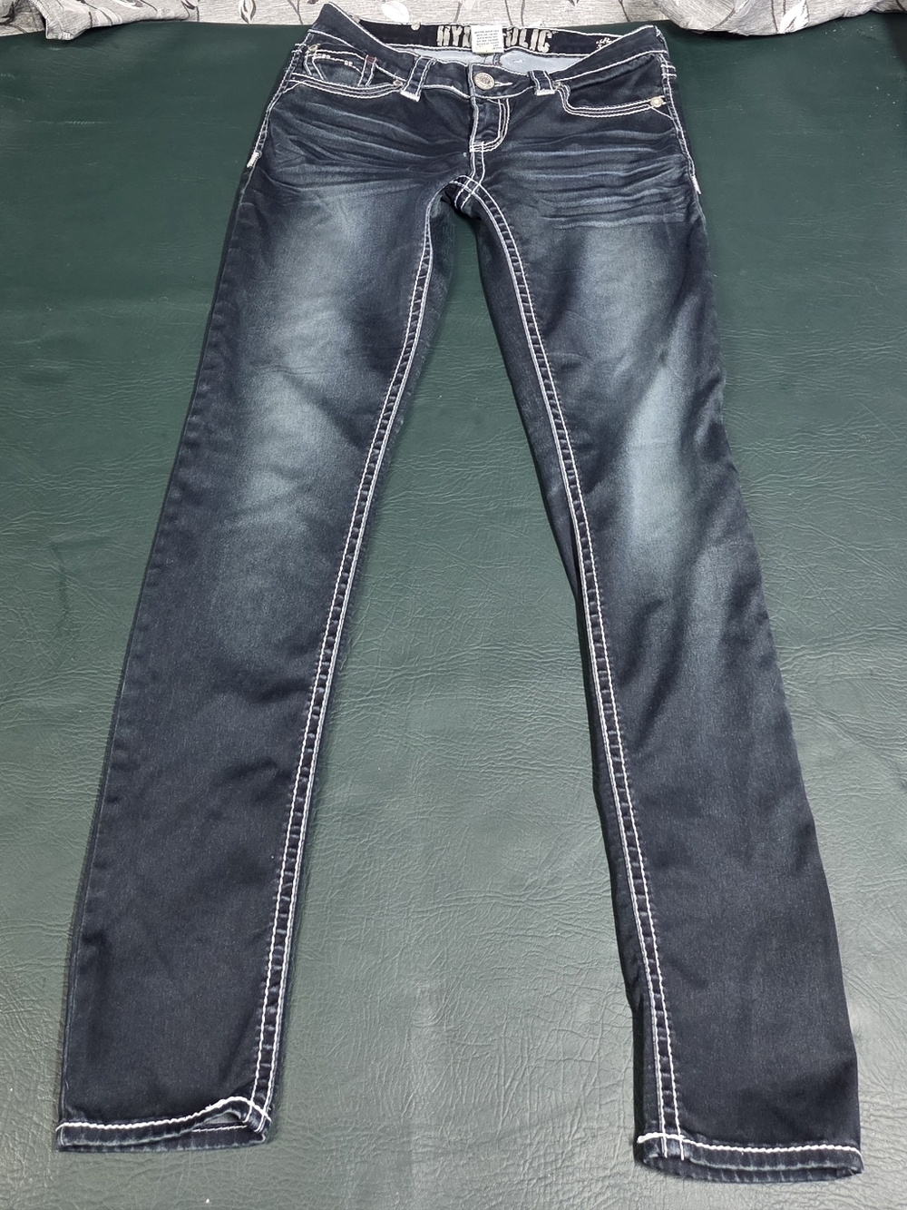 **Dark Wash Jeans with White Contrast Stitching**